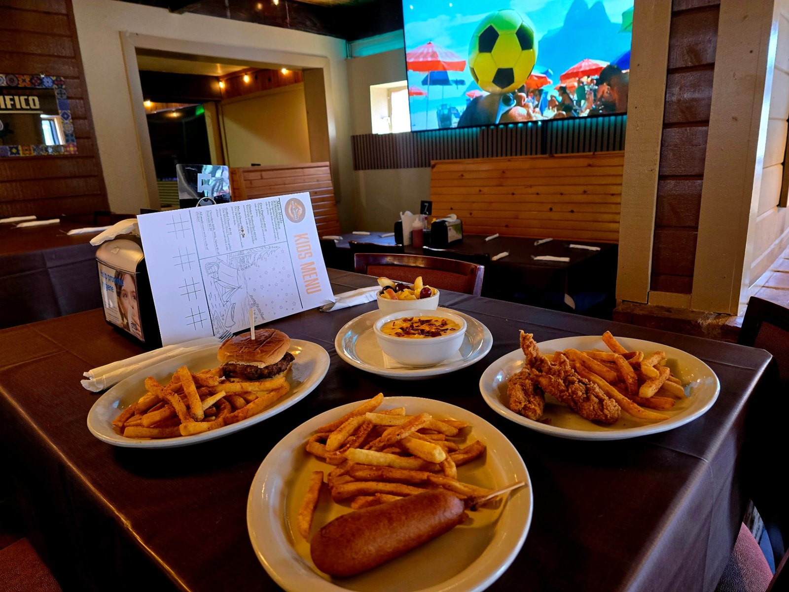 Kids meals at Vista Lounge: a junior cheeseburger, chicken tenders, a corn dog, fries, mac and cheese and a fruit cup
